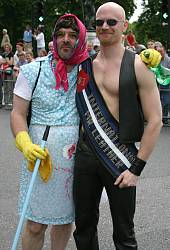 Photo of John meeting a drag cleaning-woman on the London Gay Pride march, July 2003