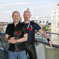Photo of Dave and John on the balcony of City Hall after their partnership registration. June 2003